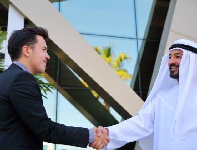 Two business men shaking hands